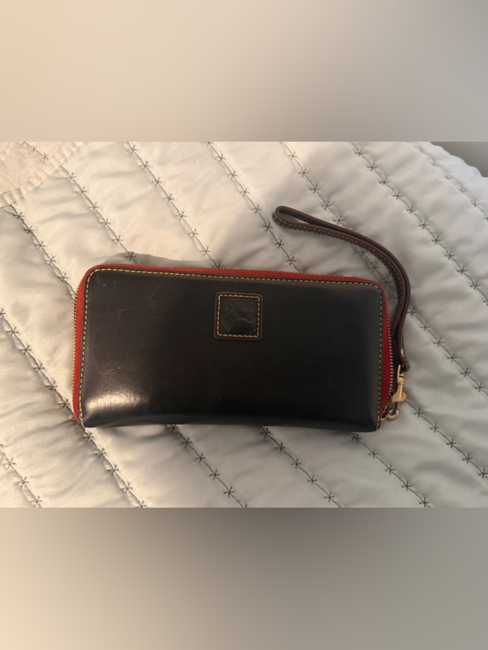 Dooney & Bourke Black Leather Zip Wallet with Red Trim